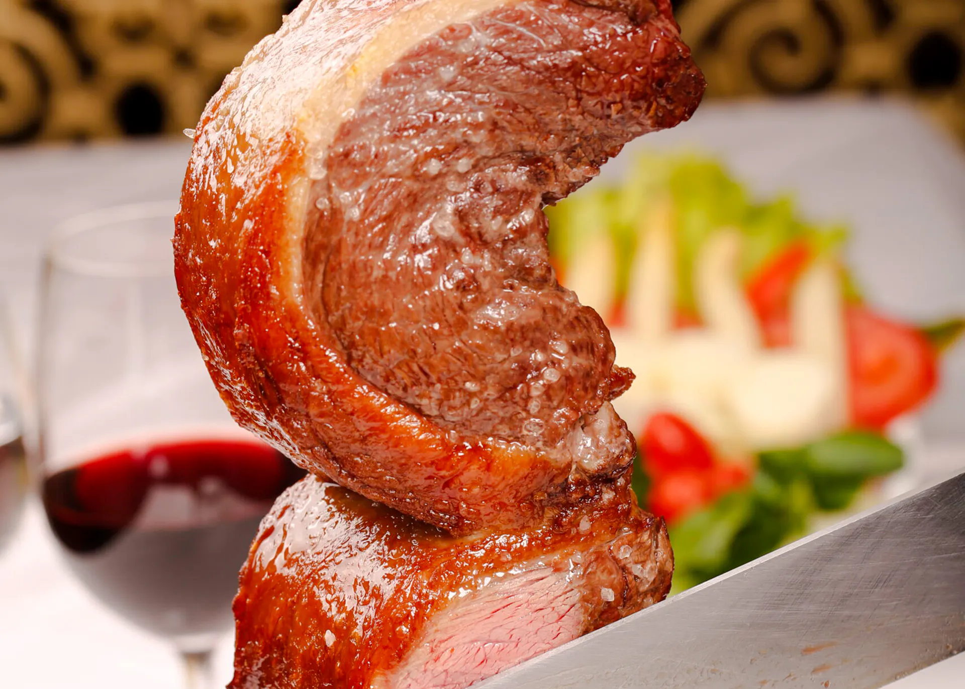 Sliced picanha steak at a Brazilian steakhouse in Rio de Janeiro.
