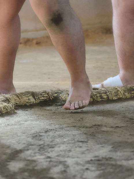 Sumo wrestlers' feet on training ring in Tokyo.