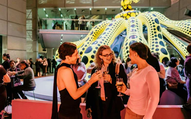 Guests enjoying drinks at NGV Friday Nights, Cartier Exhibition, National Gallery Victoria.