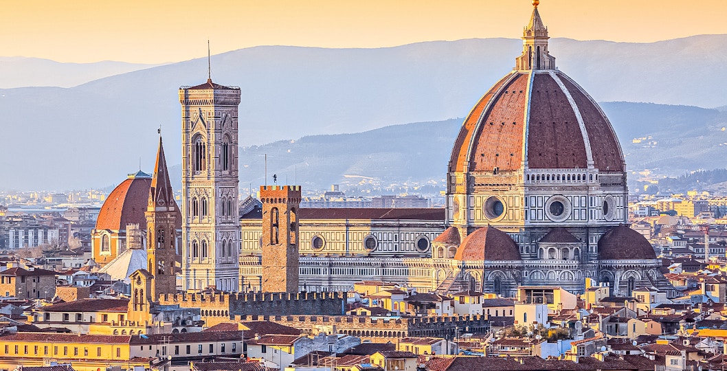 Florence skyline featuring the Duomo and Giotto's Campanile at sunset.