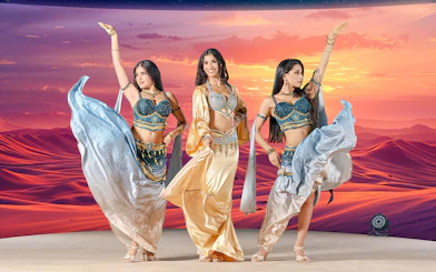 Dancers performing at sunset during live entertainment at Noble Camp Desert Safari.