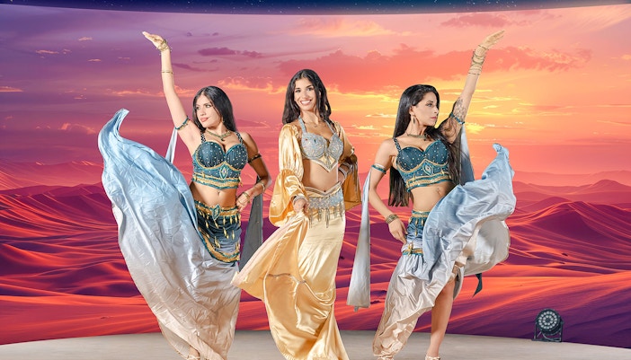 Dancers performing at sunset during live entertainment at Noble Camp Desert Safari.