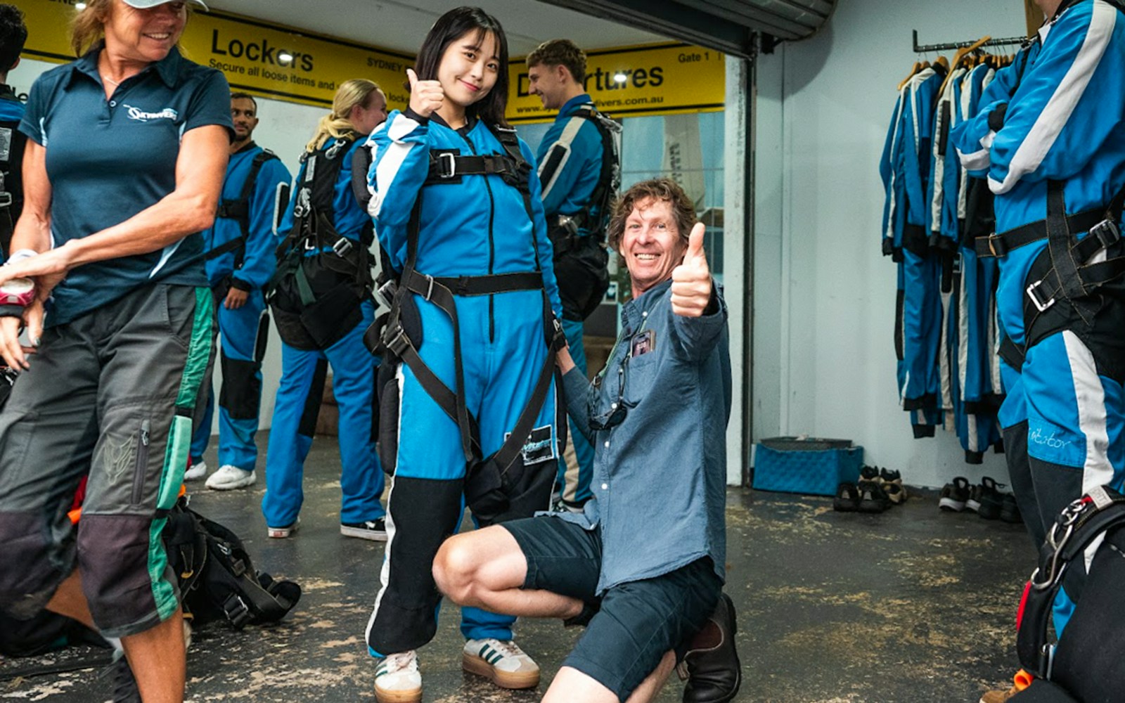 Skydivers preparing for Sydney tandem skydive with city transfers.