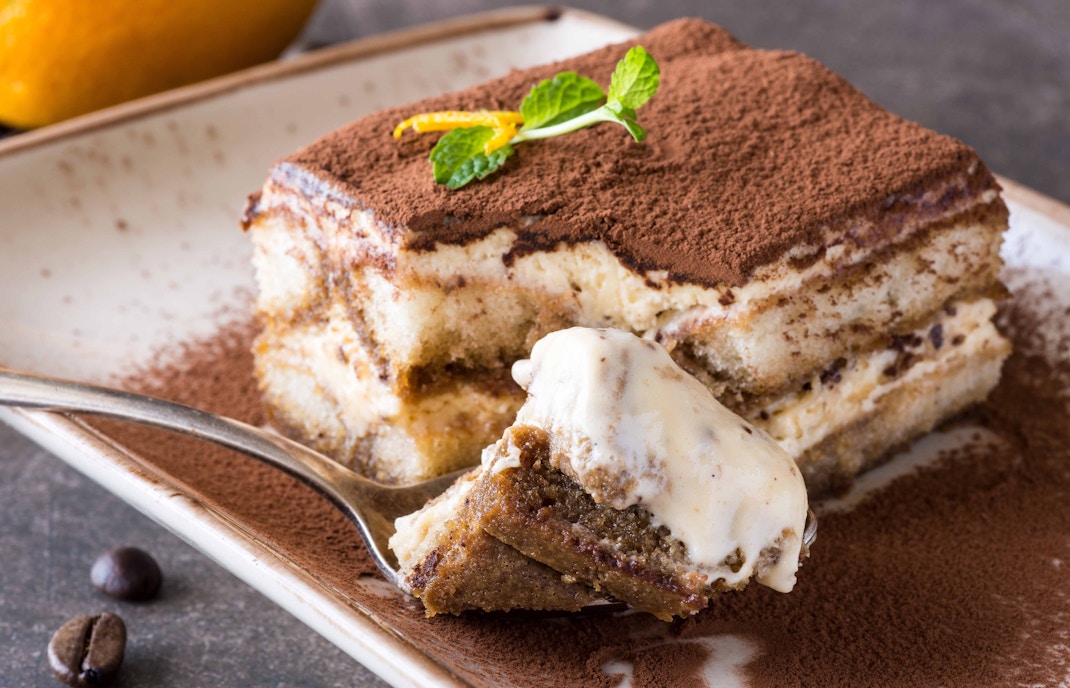 Italian pastry assortment on a wooden table in Montjuïc restaurant