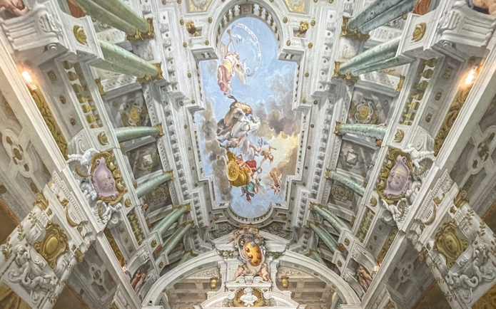 Pitti Palace ceiling frescoes depicting mythological figures in Florence, Italy.