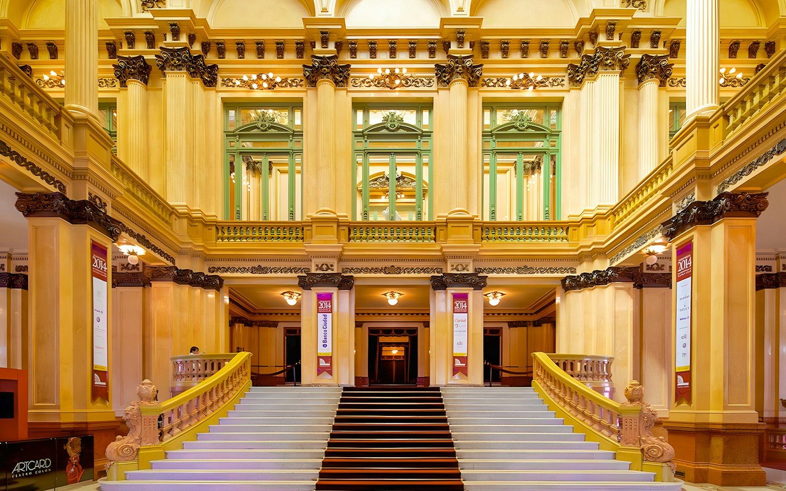 Teatro Colon grand staircase and ornate interior architecture.