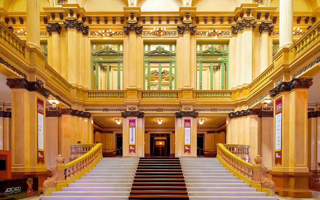 Teatro Colon grand staircase and ornate interior architecture.
