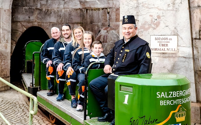 Visitors on a train tour at Berchtesgaden Salt Mine, Bavaria.