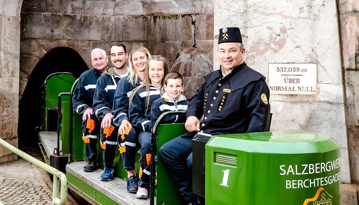 Visitors on a train tour at Berchtesgaden Salt Mine, Bavaria.