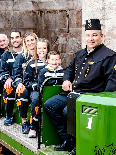 Visitors on a train tour at Berchtesgaden Salt Mine, Bavaria.