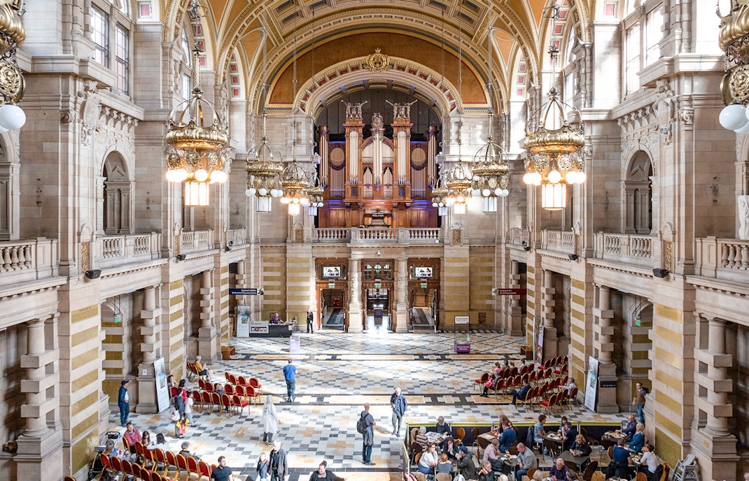 Visitors and artworks inside the Kelvingrove Art Gallery and Museum