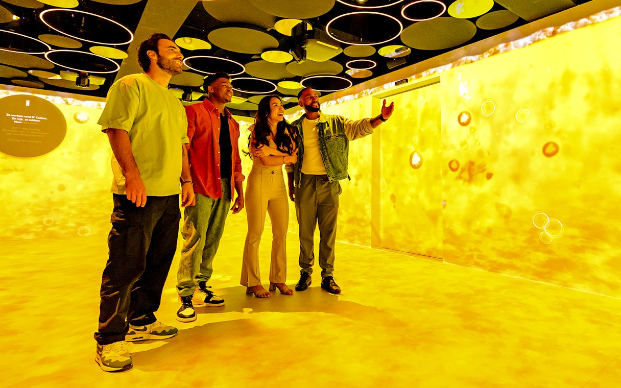 Guests exploring interactive exhibit at Belgian Beer World Experience, Brussels.