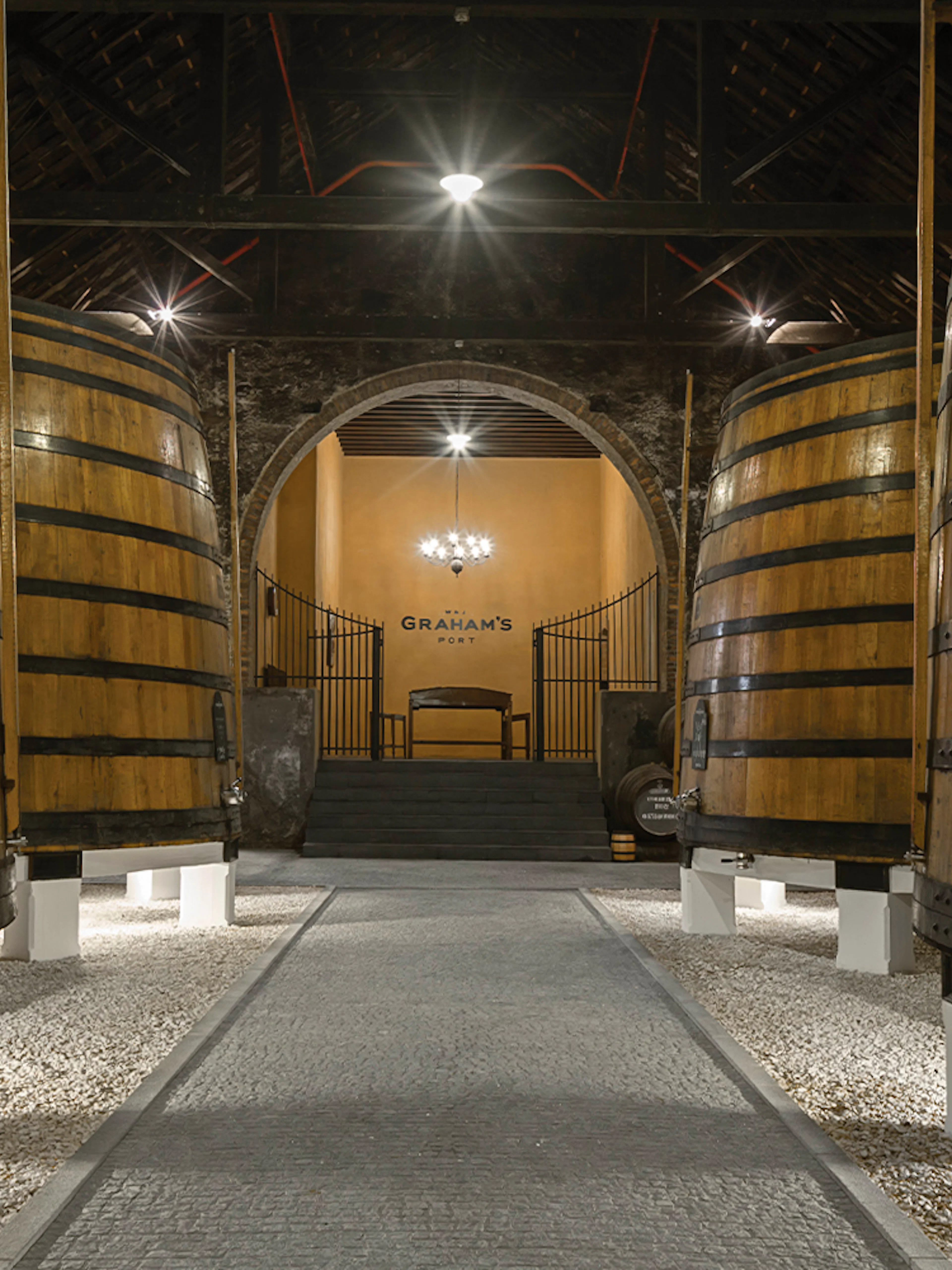 Graham's Port Lodge interior with large wooden barrels, Portugal.