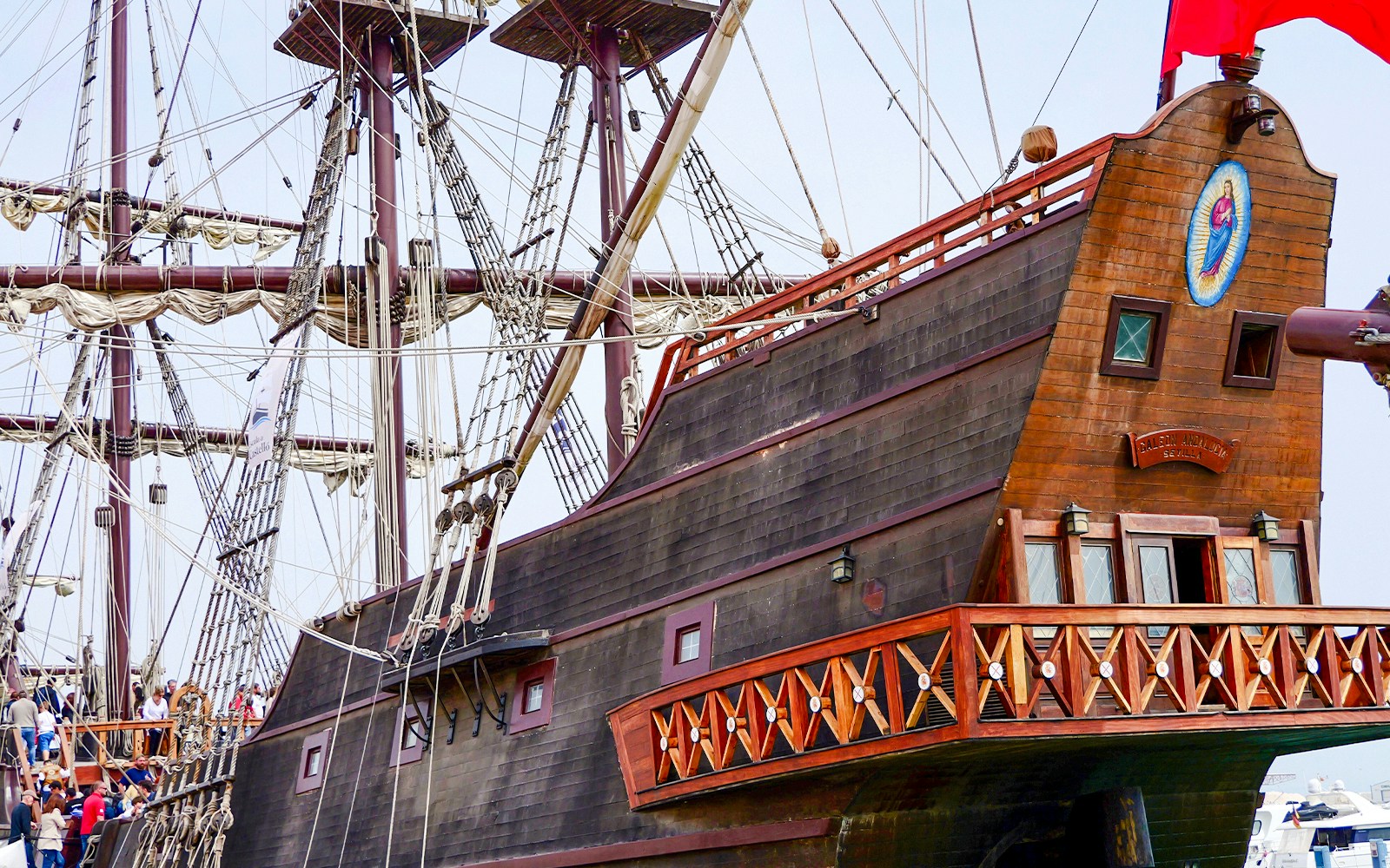 El Galeón sail ship docked at a harbor with historical masts and rigging, showcasing maritime heritage.