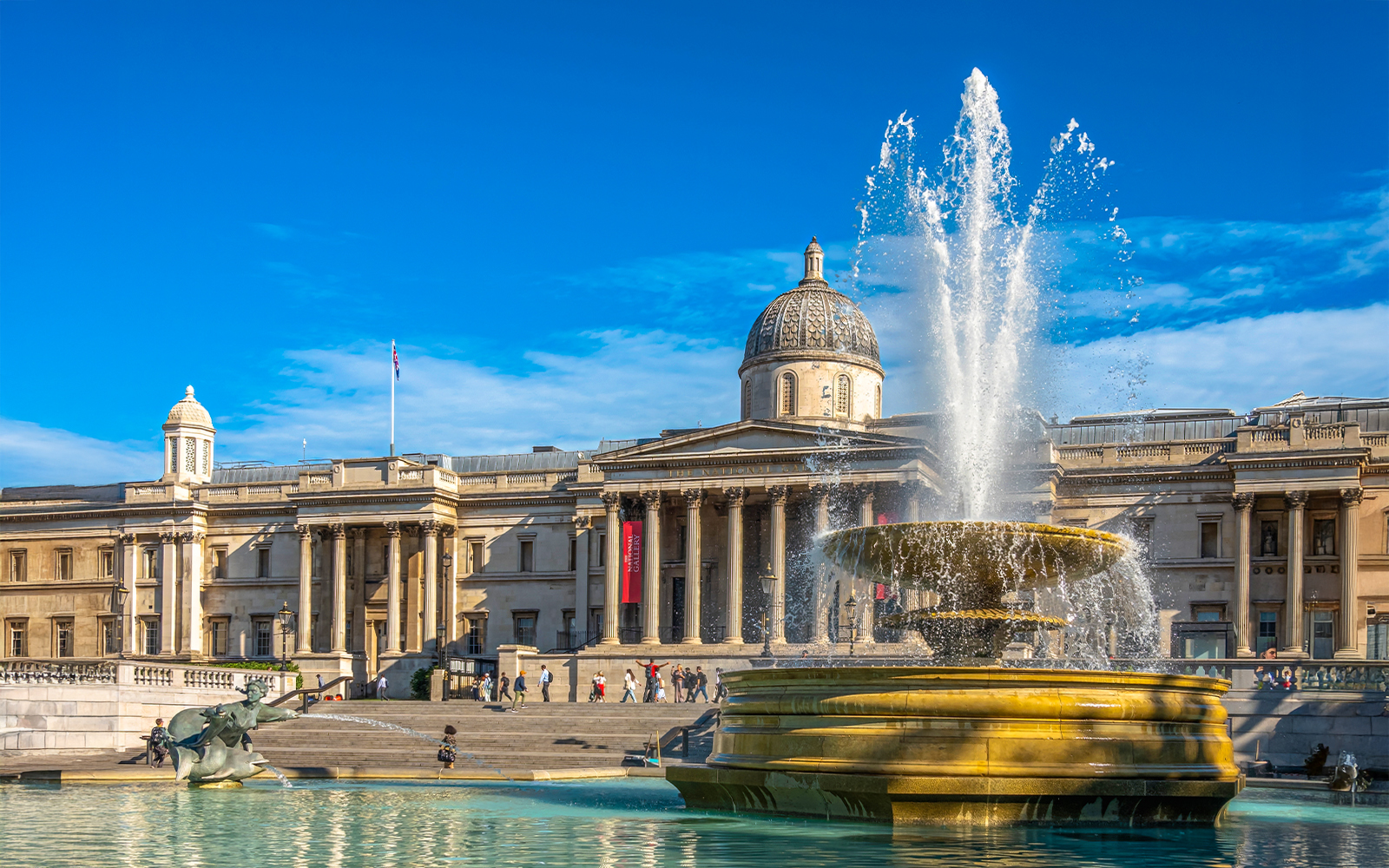 National Gallery exterior with fountain at Trafalgar Square, London.