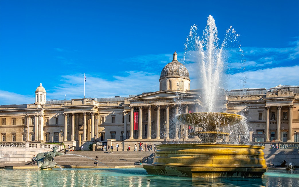 National Gallery exterior with fountain at Trafalgar Square, London.