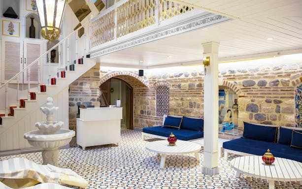 Catmamescit Hamam interior in Beyoglu with traditional decor and seating area.