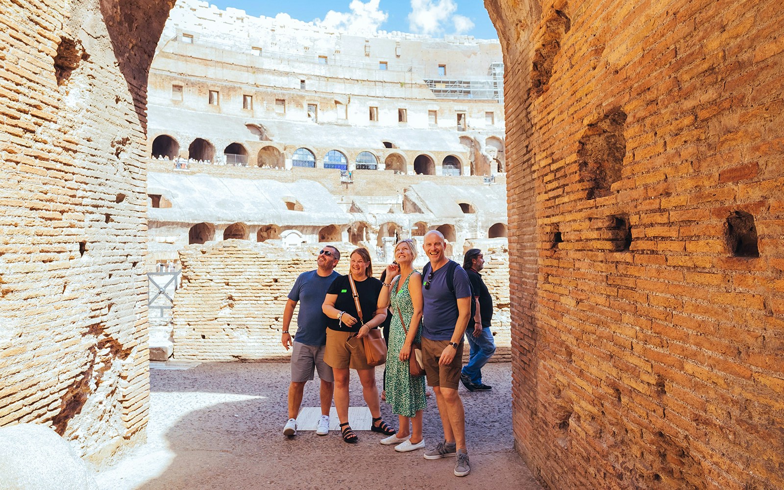 Tourists on the Colosseum arena floor during a semi-private tour with Gladiator’s Entrance.