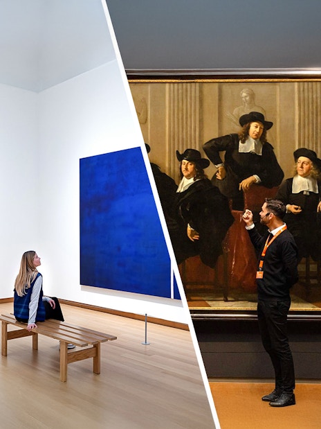 Exhibit view at Stedelijk Museum Amsterdam with visitors observing modern and classical art.