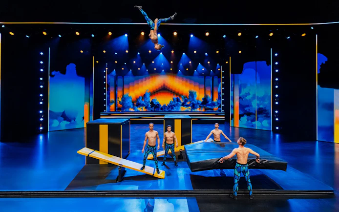 Performers executing acrobatics on stage at Friedrichstadt Palast, Berlin.