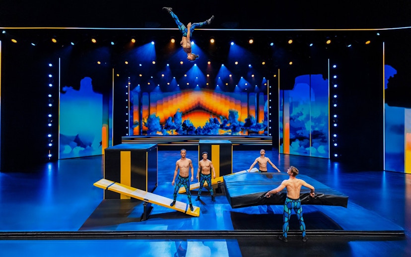 Performers executing acrobatics on stage at Friedrichstadt Palast, Berlin.