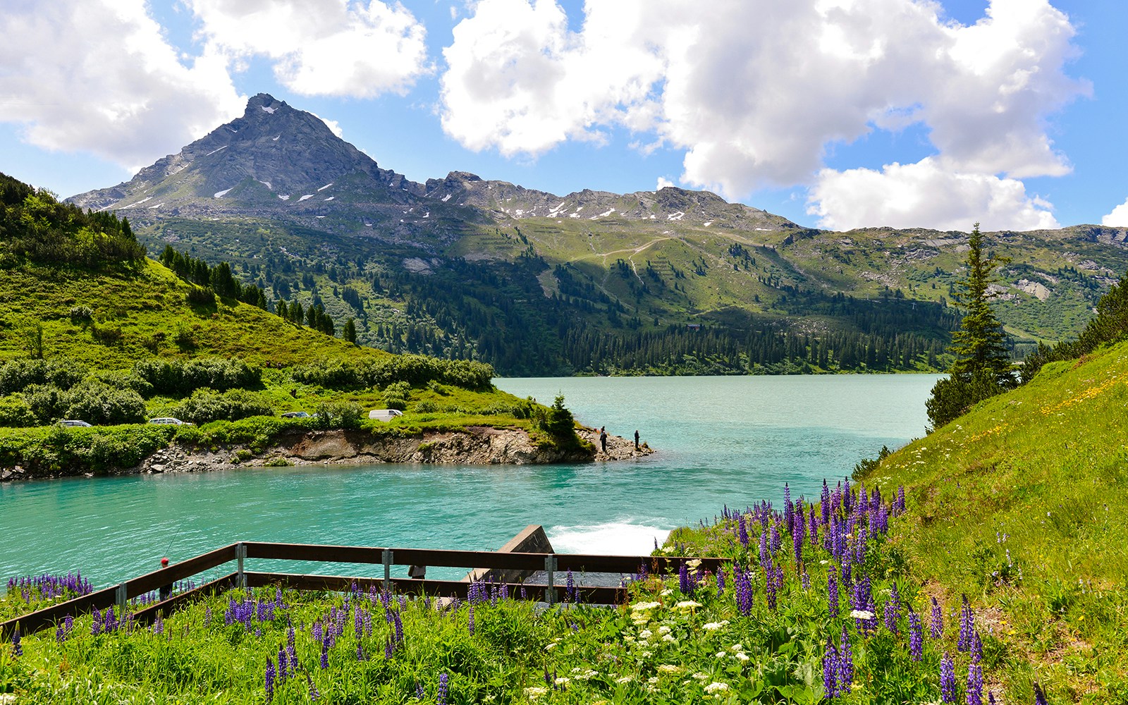 Kops Reservoir shore path in Montafon-Vorarlberg with scenic mountain views.