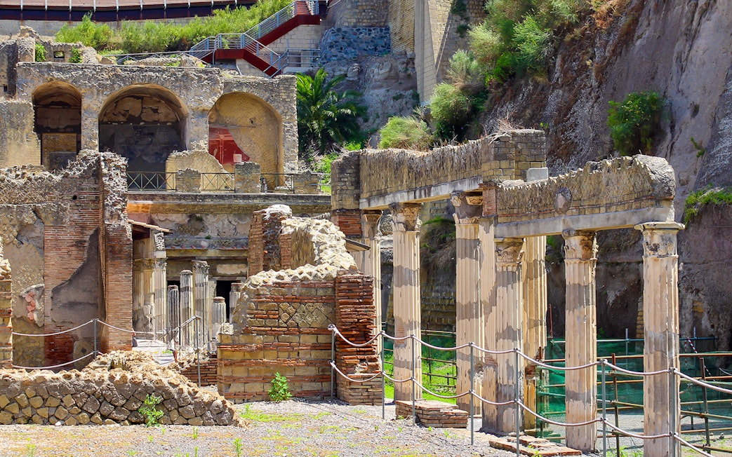 Ancient columns and ruins at the archaeological site of Herculaneum, Italy.