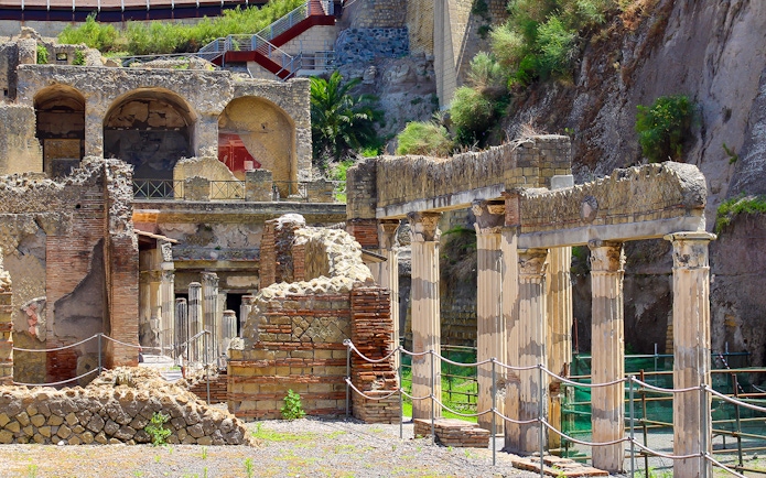 Ancient columns and ruins at the archaeological site of Herculaneum, Italy.