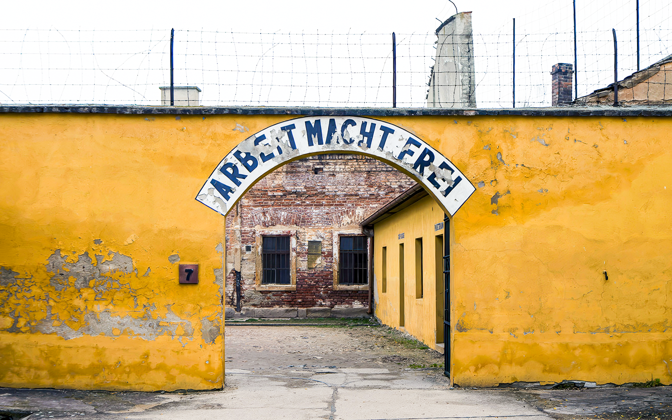 Entrance gate of Terezin concentration camp with "Arbeit Macht Frei" sign.