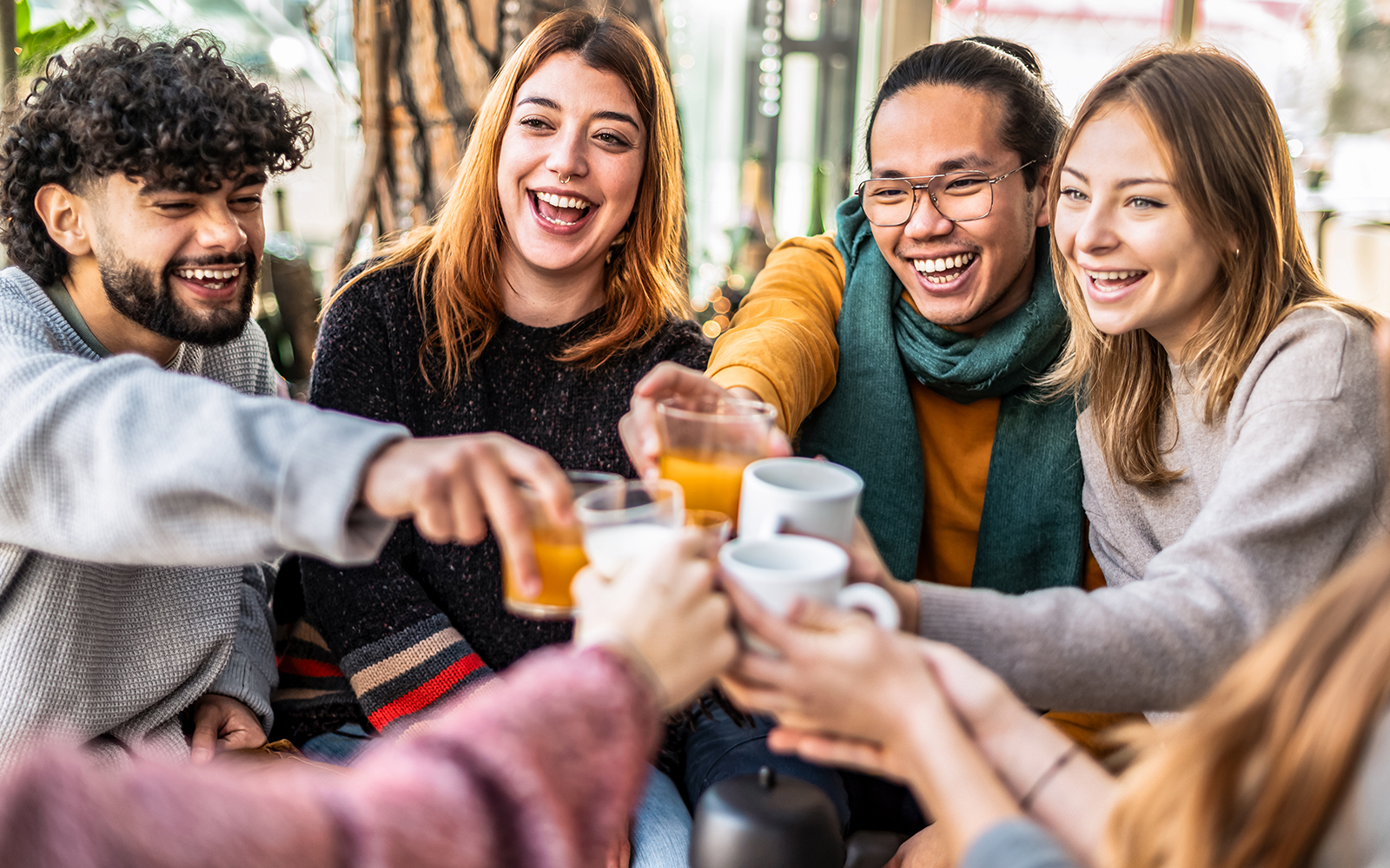 People talking and having fun together at a club till sunrise after partying whole night.