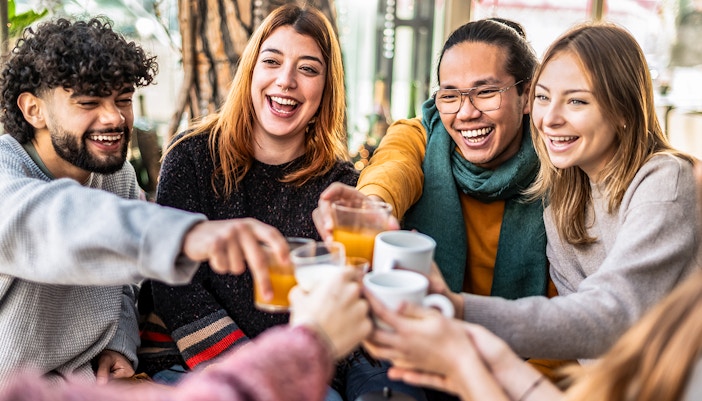 People talking and having fun together at a club till sunrise after partying whole night.
