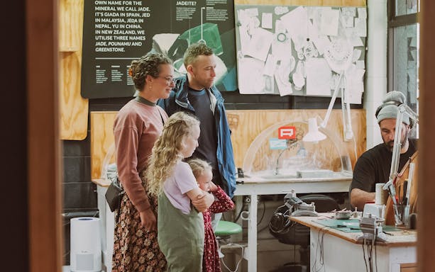 Family observing jade carving process on Mountain Jade Highlights Tour.