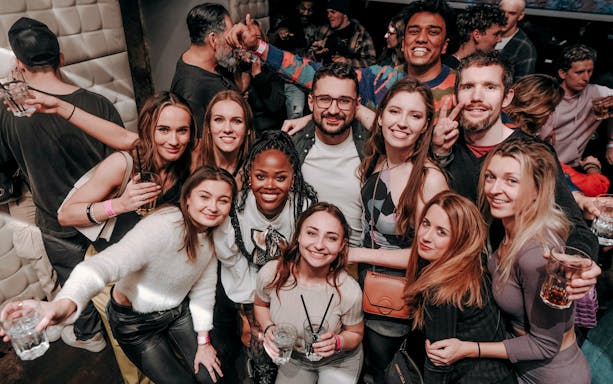 Group enjoying nightlife on a Krakow pub crawl.