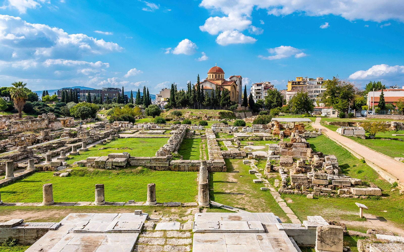 Kerameikos archaeological site with ancient ruins and church in Athens, Greece.