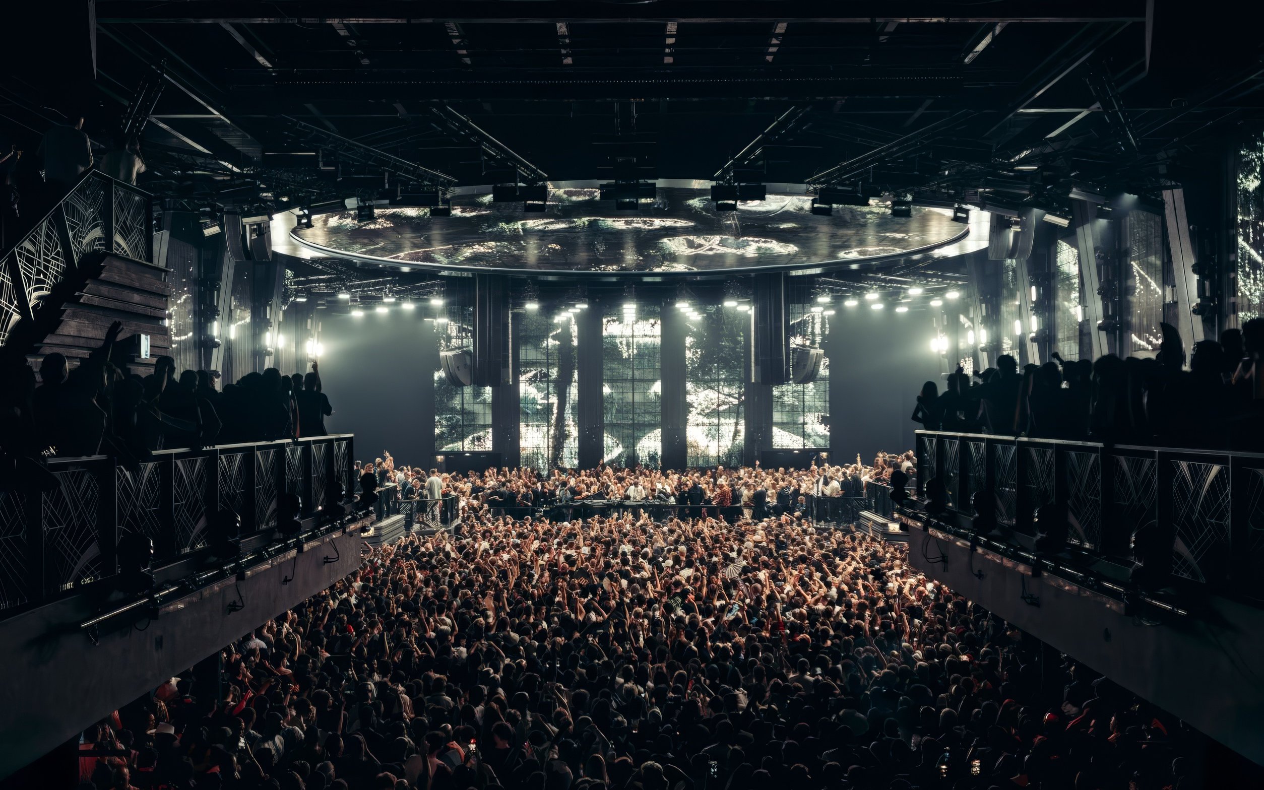Black Coffee performing at UNVRS Ibiza with a large crowd and vibrant stage lights.