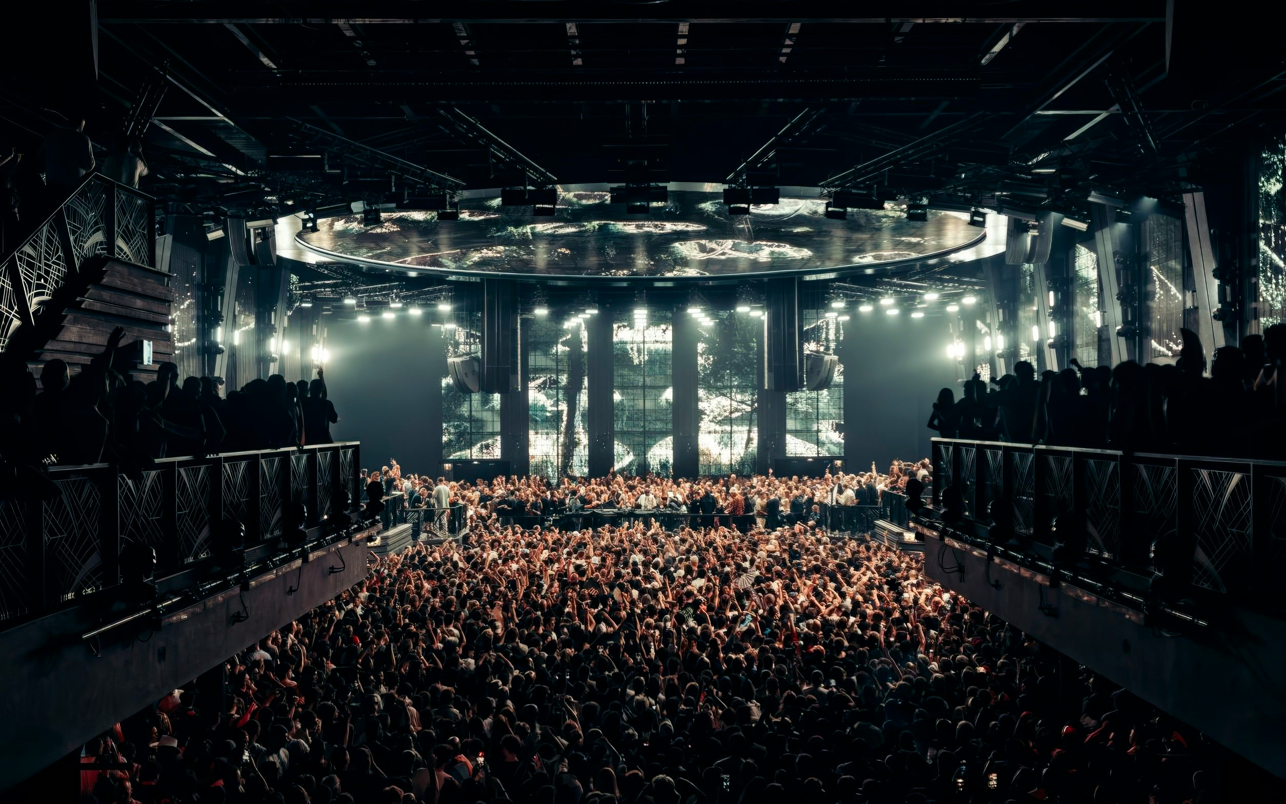 Black Coffee performing at UNVRS Ibiza with a large crowd and vibrant stage lights.