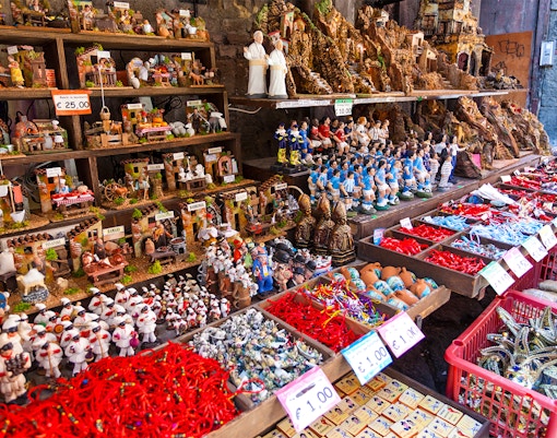 Nativity figurines and souvenirs displayed on San Gregorio Armeno street in Naples.