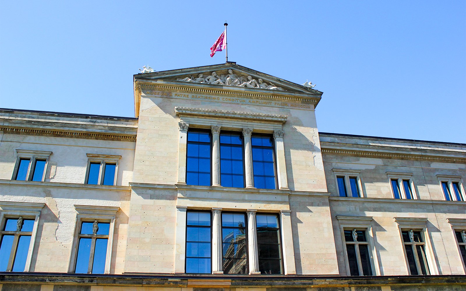 Neues Museum facade on Museum Island, Berlin, showcasing neoclassical architecture.