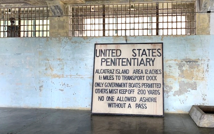 Alcatraz Island penitentiary sign inside historic prison, San Francisco Bay.