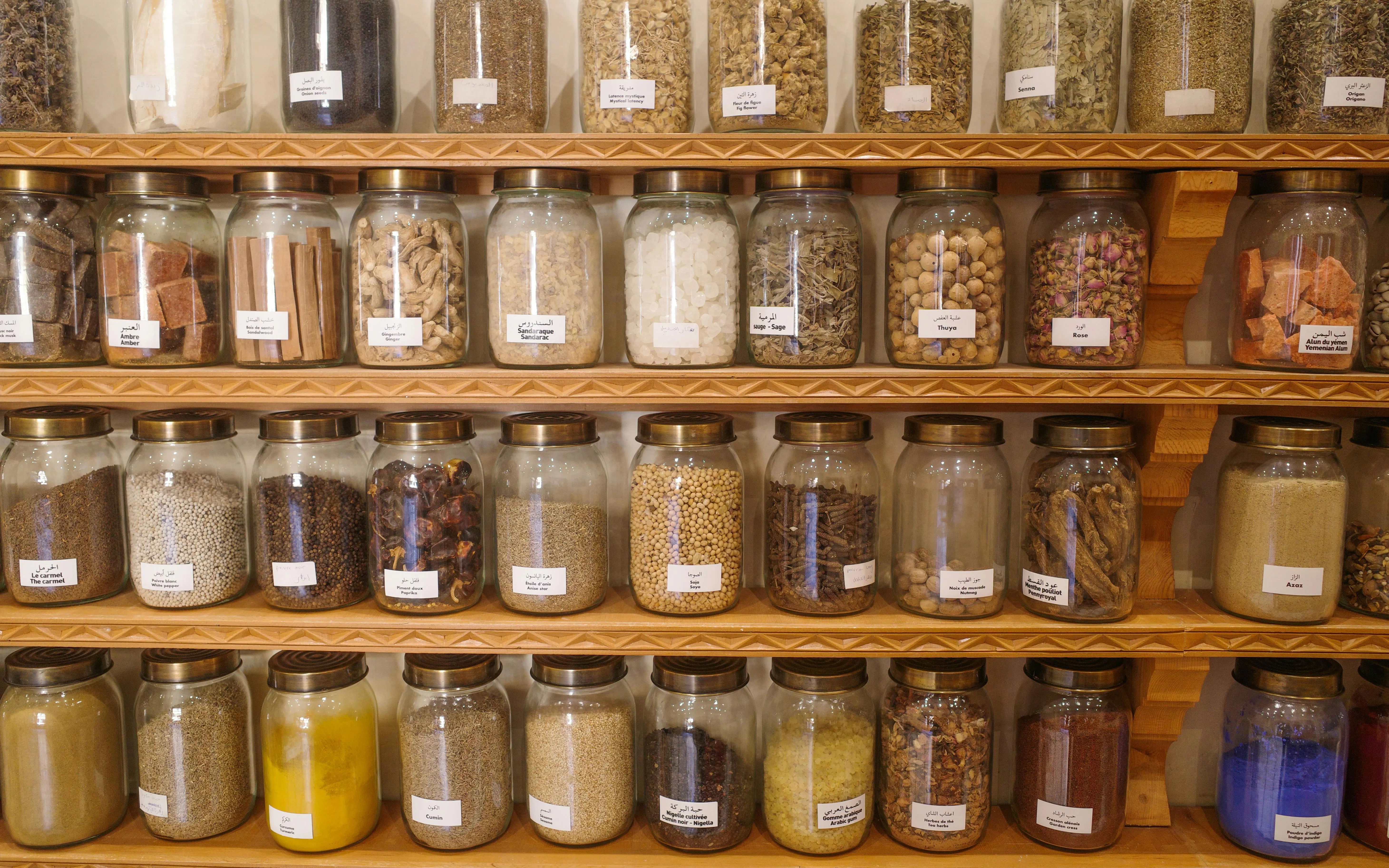 Jars of dried seeds and spices at the Moroccan Museum of Culinary Arts in Marrakech, Morocco.