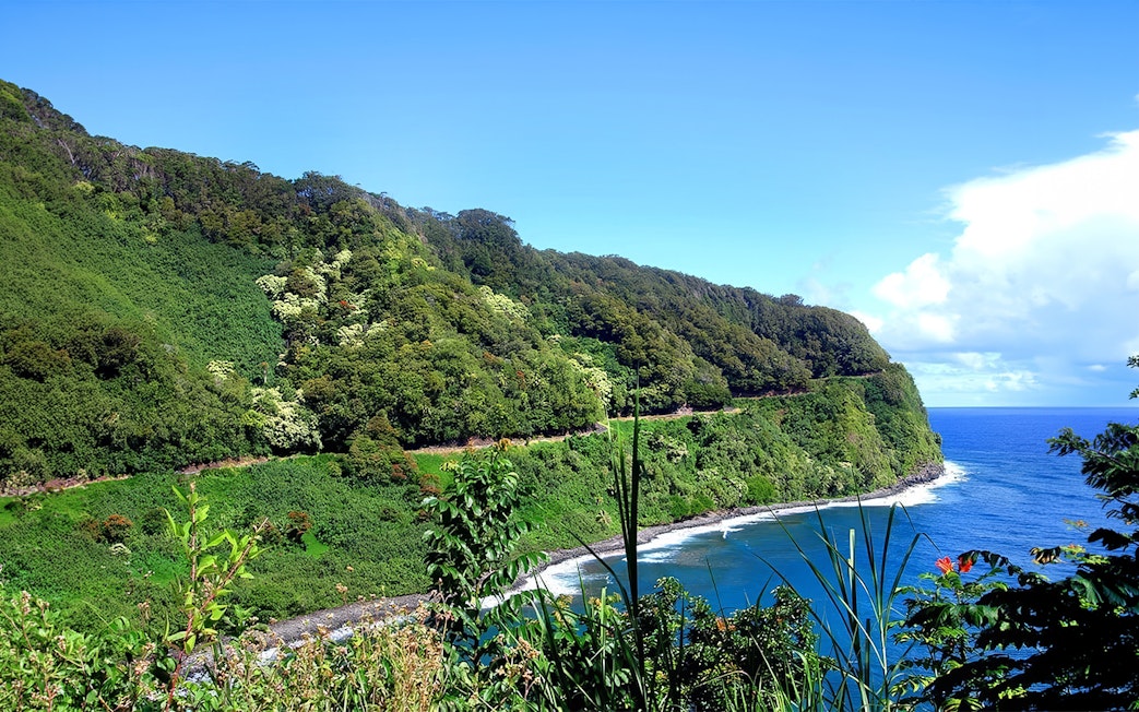Road to Hana coastal view with lush greenery and ocean, Haiku, Maui, Hawaii.