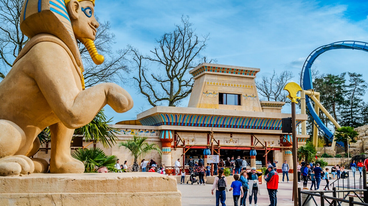 Thrilling roller coaster ride at Parc Asterix, France, with excited tourists enjoying the adventure