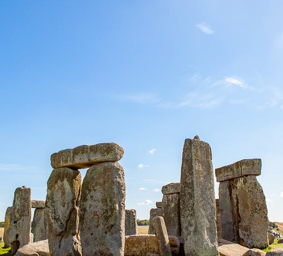 Stonehenge under a clear blue sky, part of London to Stonehenge tours.