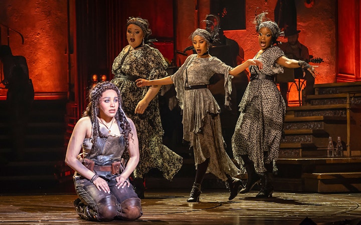 Performers on stage during Hadestown musical.