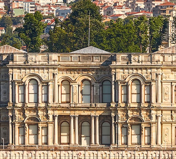 Ortaköy Mosque by the Bosphorus with Istanbul cityscape in the background.