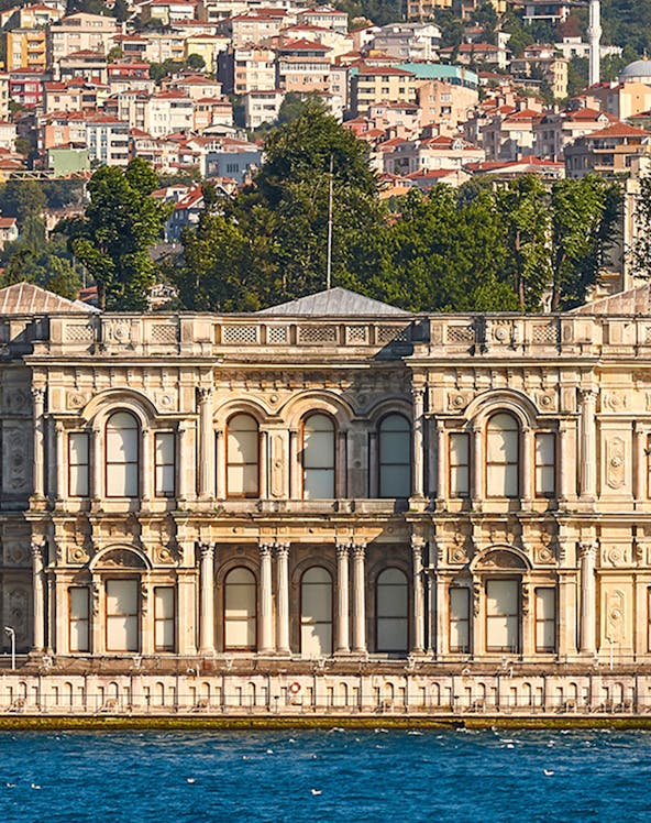 Ortaköy Mosque by the Bosphorus with Istanbul cityscape in the background.