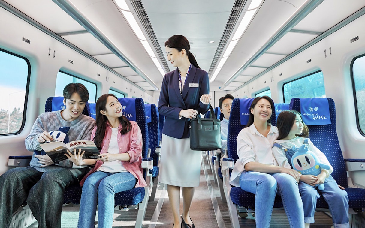 Passengers enjoying the AREX Incheon Airport Express Train journey.