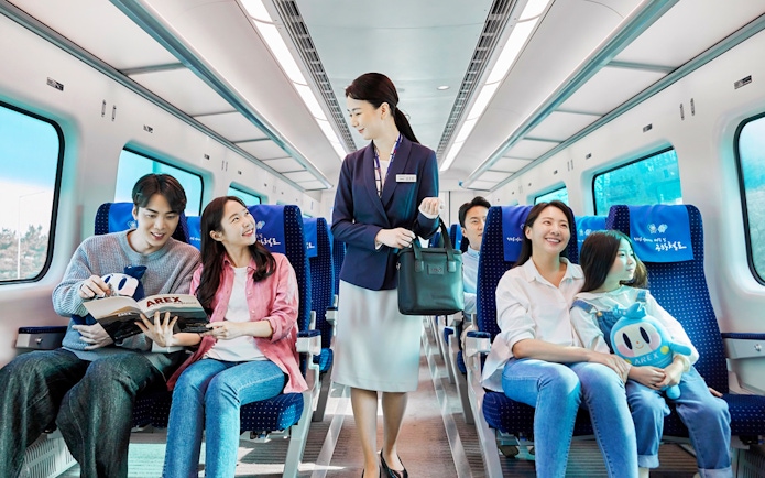 Passengers enjoying the AREX Incheon Airport Express Train journey.