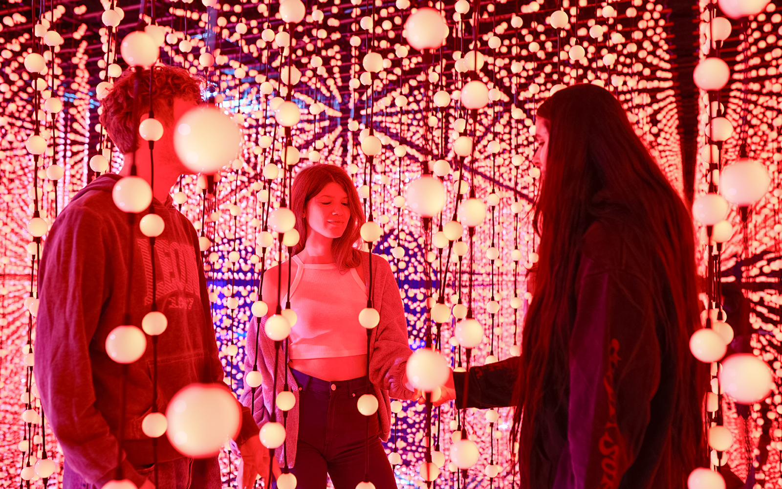 Visitors exploring Bubble Planet light installation in Washington DC.