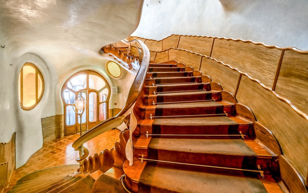 Casa Batlló interior staircase with unique wooden design, Barcelona.